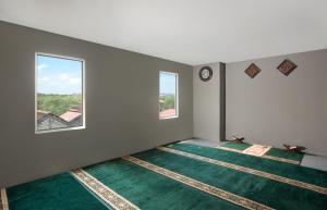 Ein Bett oder Betten in einem Zimmer der Unterkunft KHAS Gresik