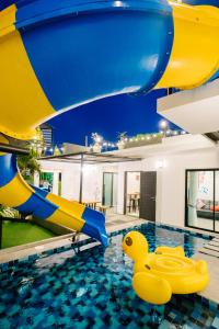 a pool with a inflatable rubber duck in the water at Modern love pool villa หัวหิน in Hua Hin