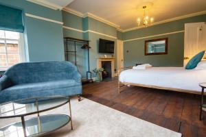 a living room with a bed and a couch at Oakhill in Matlock