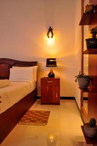Letto o letti in una camera di Sachinro Hotel Mirissa