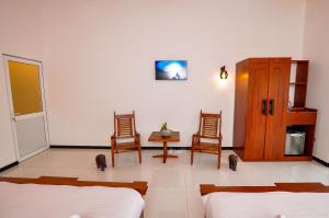 Letto o letti in una camera di Sachinro Hotel Mirissa