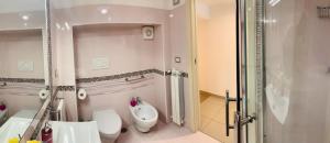 a bathroom with a toilet and a sink and a shower at Casa Marilisa in Maiori