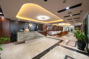 a lobby of an office with a reception counter at Nesta Boutique Hotel Hanoi in Hanoi