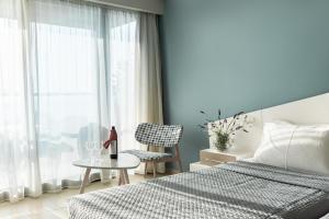 Voodi või voodid majutusasutuse Kassandra Bay Resort, Suites & Spa toas
