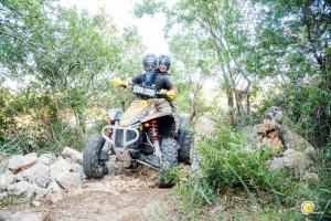 two people riding a dirt bike on a trail at Silva Apartments in Alberobello +3 photos