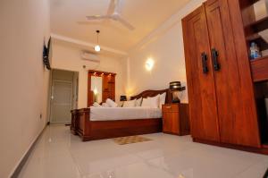 Letto o letti in una camera di Sachinro Hotel Mirissa