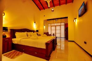 Letto o letti in una camera di Sachinro Hotel Mirissa