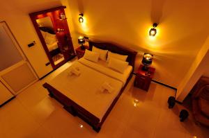 Letto o letti in una camera di Sachinro Hotel Mirissa