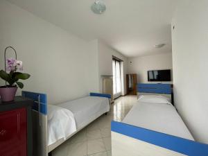 Postel nebo postele na pokoji v ubytování Appartamento tranquillo con vista montagna