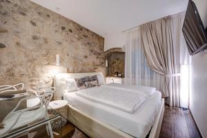 Postel nebo postele na pokoji v ubytování Arcadia Rooms