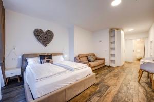 Postel nebo postele na pokoji v ubytování Arcadia Rooms