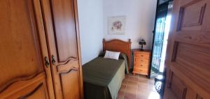 Postel nebo postele na pokoji v ubytování Huerta Carrión, Finca en El Pedroso