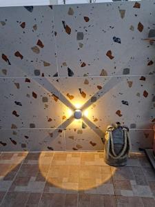 a room with a rock wall with a light on it at Christo΄s country house¨! in Artemida