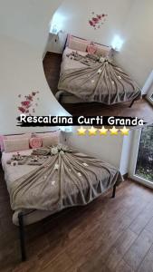 Postel nebo postele na pokoji v ubytování Curti Granda