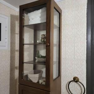 a wooden hutch in a room with at GREAT APARTMENT IN VERIA in Veria