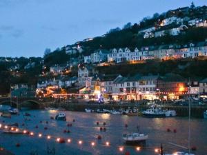 a harbor with boats in the water at night at Little Mainstone Guest House in Looe