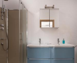 a bathroom with a sink and a shower at Les Oliviers - Studios & Apartments in Vourvourou +38 photos