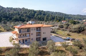 an aerial view of a house in a field at Les Oliviers - Studios & Apartments in Vourvourou