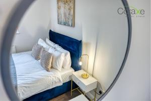 Ένα ή περισσότερα κρεβάτια σε δωμάτιο στο 3 Bedroom Blissful Living for Contractors and Families by Coraxe Short Stays