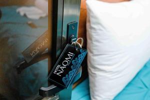 Postel nebo postele na pokoji v ubytování Hotel Naomi City center