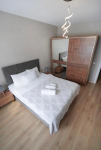 Postel nebo postele na pokoji v ubytování King Suite TH28