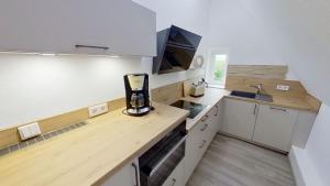 Η κουζίνα ή μικρή κουζίνα στο Ferienwohnung Leuchtturmwärter +11 φωτογραφίες