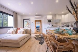 a living room with a couch and a table at Villa Venus in Ibiza Town