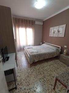 A bed or beds in a room at B&B Da Luca
