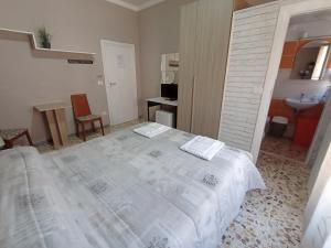 A bed or beds in a room at B&B Da Luca