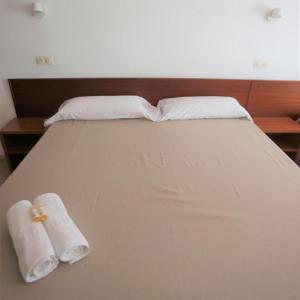 Letto o letti in una camera di Pensión Hostel Costa Brava