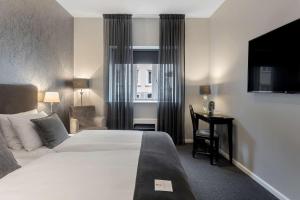 Letto o letti in una camera di Hotel Kronjylland