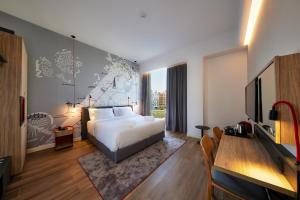 Postel nebo postele na pokoji v ubytování Ink Hotel