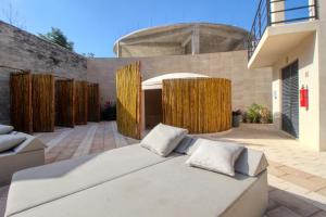 a bedroom with a bed in a courtyard at Adora Tulum 406 at Av Kukulkan in Tulum