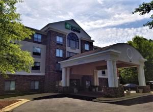 a hotel with a gazebo in front of it at Holiday Inn Express Apex - Raleigh, an IHG Hotel in Apex
