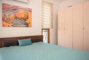 A bed or beds in a room at Cascadas Holiday Apartments