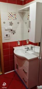a bathroom with a sink and a mirror at Penzion Svitavy in Svitavy