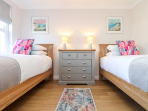 Postel nebo postele na pokoji v ubytování Gweal