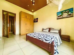 a bedroom with a bed in a room at MyPlace Suites in Kigali