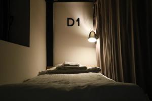 Llit o llits en una habitació de Khada Hostel