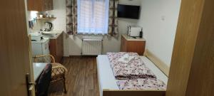 Postel nebo postele na pokoji v ubytování Penzion Svitavy