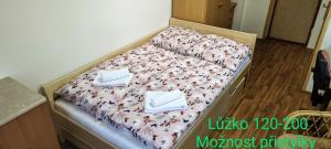 Postel nebo postele na pokoji v ubytování Penzion Svitavy