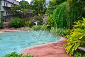 a swimming pool in the middle of a resort at LUUPI - Flats Particulares - 1 Quarto in Rio Quente