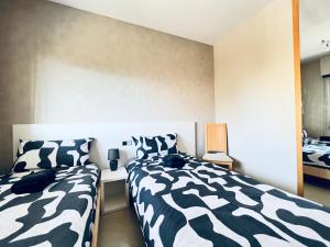 Postel nebo postele na pokoji v ubytování Magic world Marina d'Or