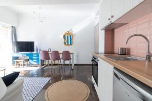 a kitchen with a sink and a counter at Retropolitan Living Patras in Patra