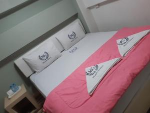 Postel nebo postele na pokoji v ubytování Miracle Gallery Hotel