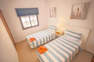 Postel nebo postele na pokoji v ubytování Club Atlántico + 37 fotografií