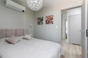 Postel nebo postele na pokoji v ubytování Lighthouse Luxury Penthouse - Jantar Apartamenty