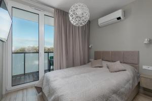 Postel nebo postele na pokoji v ubytování Lighthouse Luxury Penthouse - Jantar Apartamenty