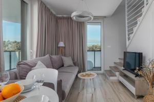 TV a/nebo společenská místnost v ubytování Lighthouse Luxury Penthouse - Jantar Apartamenty