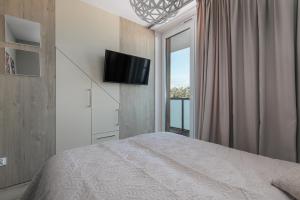 Postel nebo postele na pokoji v ubytování Lighthouse Luxury Penthouse - Jantar Apartamenty